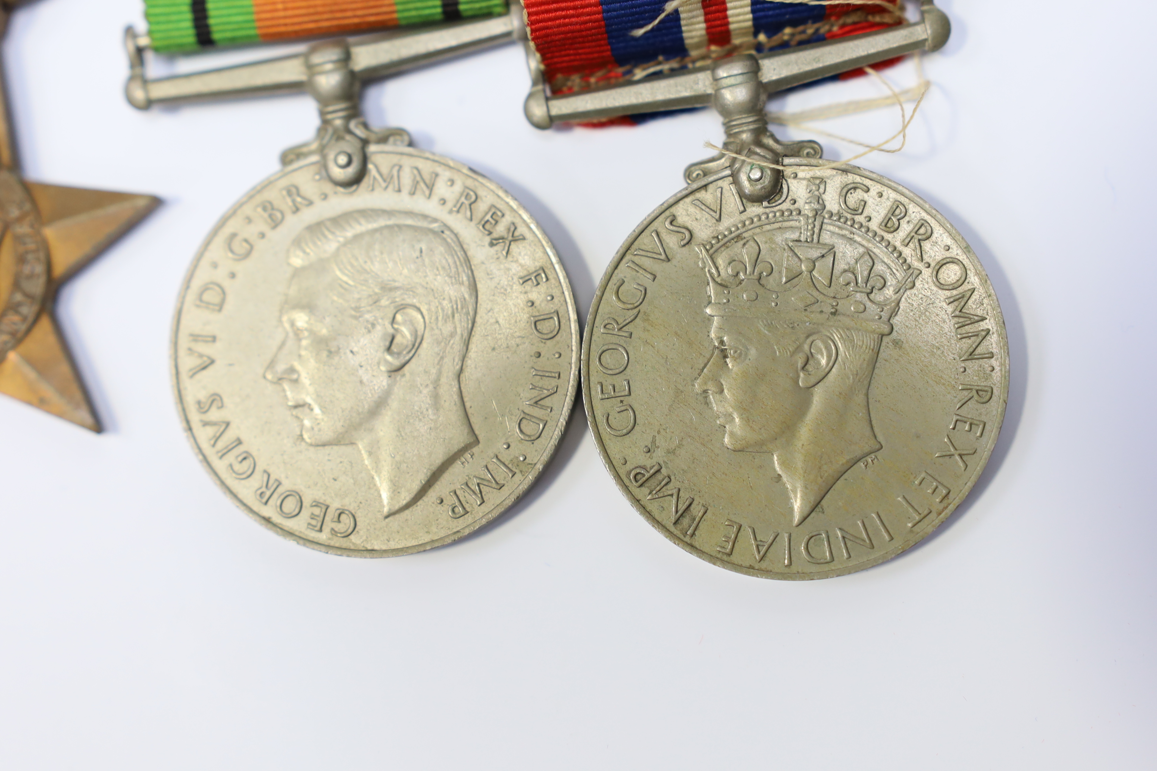 A WWII medal group awarded to Pte. J. Langridge S. Staff, comprising; a General Service Medal with two bars for Palestine and Palestine 1945-48, stamped to the edge with the recipient’s details, together with a 1939-45 S